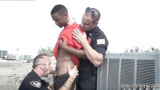 One cop holds the suspect back as the other cops enjoys the tasty treat of a big long black dick 2